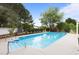 Inviting in-ground pool with a clear blue water, set in a spacious yard with mature landscaping at 5408 Colonial Oaks Dr, Apex, NC 27539