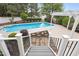 Beautiful backyard pool with a paved patio and elegant pergola, perfect for outdoor entertaining at 5408 Colonial Oaks Dr, Apex, NC 27539