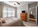 Bright bedroom with natural light from the window and includes a ceiling fan at 5733 Mizuno Dr, Fuquay Varina, NC 27526