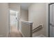 Hallway leading to full bathroom with a tiled shower/tub at 5733 Mizuno Dr, Fuquay Varina, NC 27526