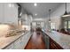Spacious kitchen offers an expansive island with seating, granite countertops and a dining area at 5733 Mizuno Dr, Fuquay Varina, NC 27526