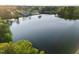 Breathtaking aerial perspective of a expansive lake surrounded by vibrant greenery at 5733 Mizuno Dr, Fuquay Varina, NC 27526