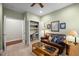 Comfortable living room with a leather sofa and a built-in office at 5733 Mizuno Dr, Fuquay Varina, NC 27526