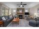 Cozy living room features a stone fireplace, built-in shelves, and comfortable seating at 5733 Mizuno Dr, Fuquay Varina, NC 27526