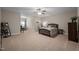 Spacious main bedroom with ceiling fan and sitting area at 5733 Mizuno Dr, Fuquay Varina, NC 27526