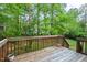 This outdoor back deck has stairs leading down to the back yard at 5911 Mountain Island Dr, Durham, NC 27713