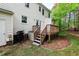 This back deck has stairs leading up to the house at 5911 Mountain Island Dr, Durham, NC 27713