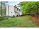 This spacious back yard has a private back deck and mature trees at 5911 Mountain Island Dr, Durham, NC 27713