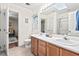 Bathroom with a double vanity, and an adjoining bedroom, offering convenience at 5911 Mountain Island Dr, Durham, NC 27713