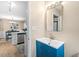 Bathroom vanity with modern sink and fixtures, adjacent to bright kitchen at 5911 Mountain Island Dr, Durham, NC 27713