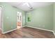 This bright bedroom has hardwood floors, fresh paint, and a bathroom adjacent to the bedroom at 5911 Mountain Island Dr, Durham, NC 27713