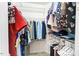 Walk-in closet with organized hanging space and shelving for storage at 5911 Mountain Island Dr, Durham, NC 27713