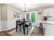 Charming dining area featuring a table with seating, French doors, and views of the outdoor patio at 5911 Mountain Island Dr, Durham, NC 27713
