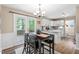 Cozy dining area adjacent to the kitchen, featuring a table with seating and access to the outdoor deck at 5911 Mountain Island Dr, Durham, NC 27713