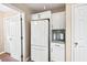 Bright kitchen featuring white refrigerator, cabinets and countertops at 5911 Mountain Island Dr, Durham, NC 27713