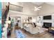 Inviting living room with soaring ceilings, fireplace, and a staircase leading to the second floor at 5911 Mountain Island Dr, Durham, NC 27713
