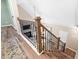 Elegant staircase featuring wood treads, iron railings, and natural light at 5911 Mountain Island Dr, Durham, NC 27713