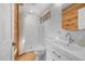 Modern bathroom with white subway tile, a sleek vanity, and a walk-in shower, designed for a clean and contemporary feel at 605 Faucette Mill Rd, Hillsborough, NC 27278