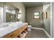 Modern bathroom features a marble countertop with a square sink and wood vanity at 605 Faucette Mill Rd, Hillsborough, NC 27278