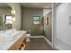 Stylish bathroom showcases a modern vanity, and a bright subway-tiled shower at 605 Faucette Mill Rd, Hillsborough, NC 27278