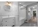 Bright bathroom features white subway tiles, a bathtub, and a modern vanity at 605 Faucette Mill Rd, Hillsborough, NC 27278