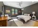 Well-lit bedroom with a large window and calming decor offers a serene retreat at 605 Faucette Mill Rd, Hillsborough, NC 27278