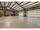Expansive garage with multiple garage doors and abundant workspace at 605 Faucette Mill Rd, Hillsborough, NC 27278