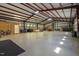 Expansive garage with a high ceiling, ample natural light, and a concrete floor, offering abundant space for various needs at 605 Faucette Mill Rd, Hillsborough, NC 27278