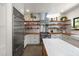 Modern kitchen with stainless steel appliances, butcher block countertops, and open shelving at 605 Faucette Mill Rd, Hillsborough, NC 27278