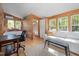 Bright, multi-functional living space with a bed, sofa, and en-suite bathroom, ideal for comfortable living and convenience at 605 Faucette Mill Rd, Hillsborough, NC 27278