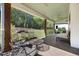 Comfortable seating on a covered porch at 605 Faucette Mill Rd, Hillsborough, NC 27278