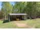 Open shed, ideal for storing equipment or tools with ample room for parking at 605 Faucette Mill Rd, Hillsborough, NC 27278