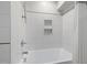Clean, bright shower features a white tub, white subway tiles, and chrome fixtures at 605 Faucette Mill Rd, Hillsborough, NC 27278