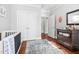 Well-lit Bedroom with dark wood floors, dresser, and decorations at 608 Derby Ct, Durham, NC 27707