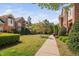 Beautifully landscaped townhouse community with green spaces and well-maintained walkways at 608 Derby Ct, Durham, NC 27707