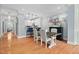 Charming dining area featuring hardwood floors, stylish lighting, and views into kitchen at 608 Derby Ct, Durham, NC 27707