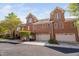 Brick townhouses with attached garages, showcasing well-kept exteriors and green landscaping at 608 Derby Ct, Durham, NC 27707