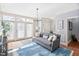 Cozy living room with a comfortable sofa, French doors, and ample natural light at 608 Derby Ct, Durham, NC 27707