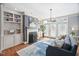 Bright living space featuring fireplace with built-ins and large window at 608 Derby Ct, Durham, NC 27707