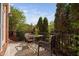 Outdoor patio area with table, chairs, and scenic backyard views at 608 Derby Ct, Durham, NC 27707