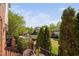 Exterior home view from patio with lush landscaping and neighborhood street at 608 Derby Ct, Durham, NC 27707