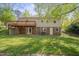 Well-maintained backyard with a lawn, patio and upper deck at 6105 Bellow St, Raleigh, NC 27609