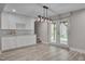 Finished basement area featuring a stylish bar with granite counters and wine rack at 6105 Bellow St, Raleigh, NC 27609