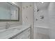 Clean bathroom featuring a glass-enclosed shower with white subway tile, a bench, and a modern vanity at 6105 Bellow St, Raleigh, NC 27609