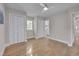 Bright bedroom featuring hardwood floors, neutral walls, and double closets for ample storage at 6105 Bellow St, Raleigh, NC 27609