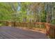 Wooden deck with a wood railing and a beautiful view at 6105 Bellow St, Raleigh, NC 27609