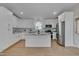 A stylish kitchen boasts white cabinets, granite countertops, and a center island at 6105 Bellow St, Raleigh, NC 27609