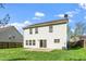 Fenced backyard with a small patio and lawn at 617 Conover Rd, Durham, NC 27703