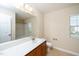 Well-lit bathroom with a long vanity and a shower/tub combo at 617 Conover Rd, Durham, NC 27703