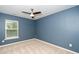 Bedroom featuring carpet flooring and a large window at 617 Conover Rd, Durham, NC 27703